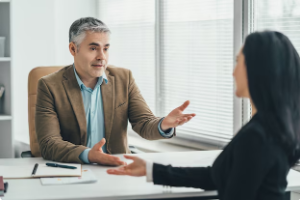 Two people having a conversation at a table