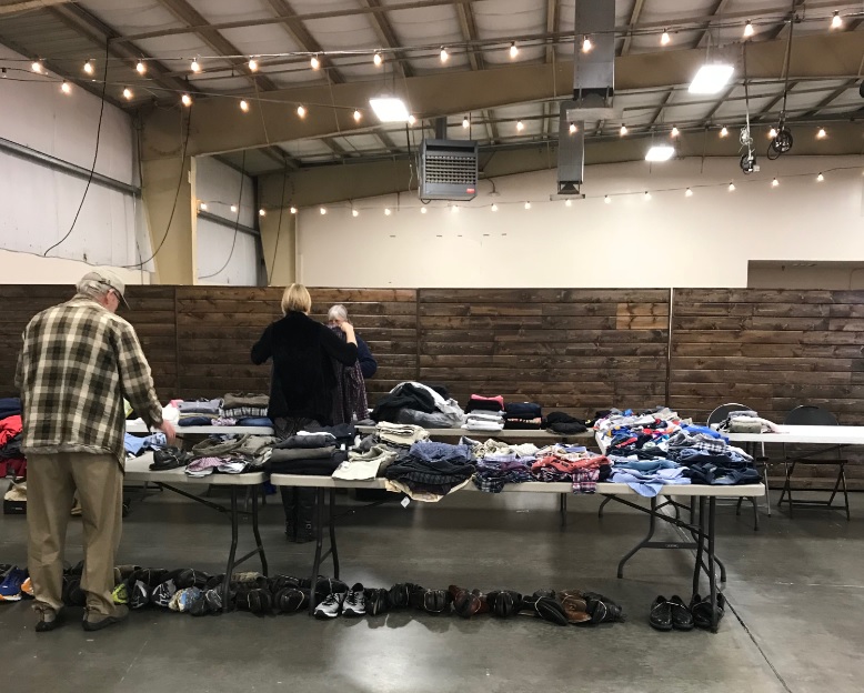 Clothing folded on tables