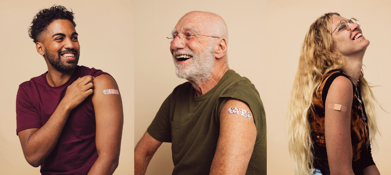 Photo of people with band aids on arms