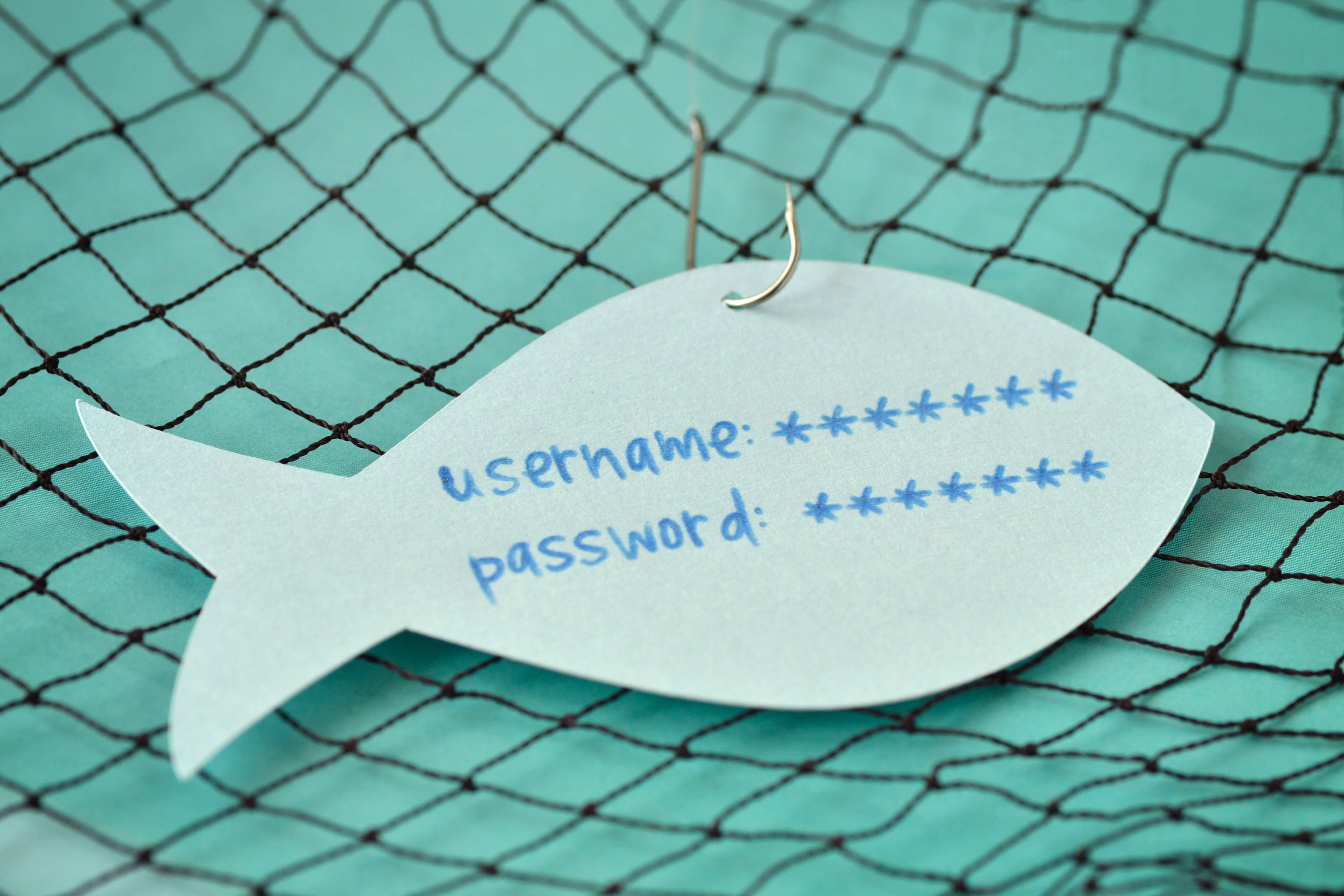 paper shaped like a fish, with fish hook attached; text reads username, password