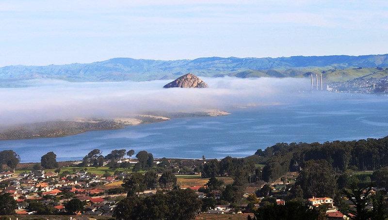 A View of the Morro Rock and the Bay among clouds