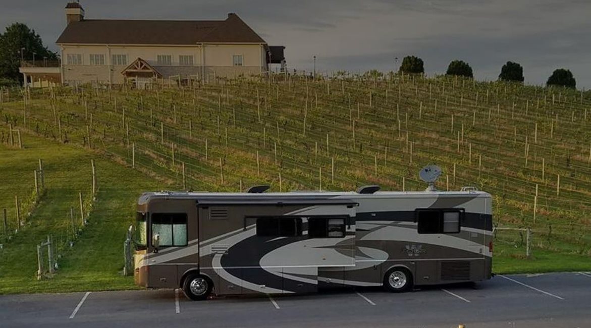 Photo of RV camping in a rural parking lot