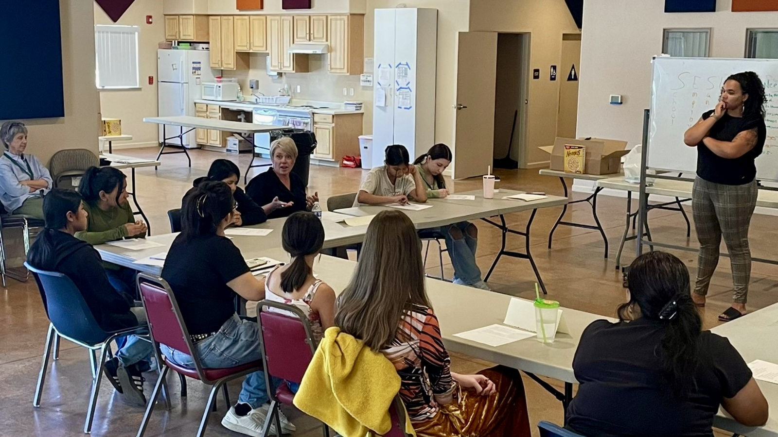 Teens listening to a Public Health Nurse talk about her field.